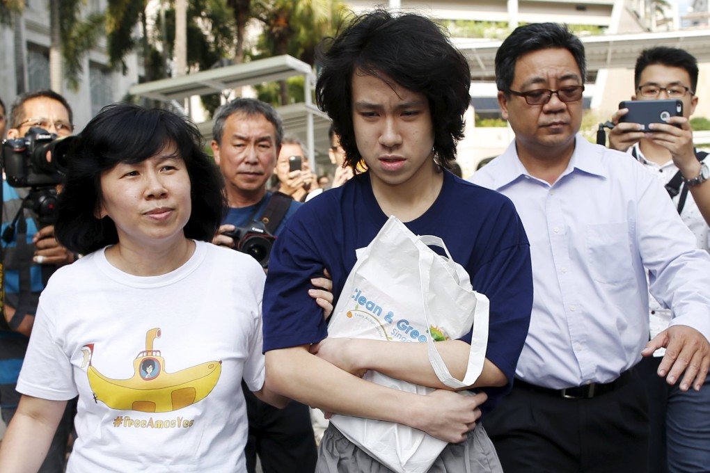 Teen blogger Amos Yee leaves with his parents after his sentencing from the State Court in Singapore. Photo: Reuters