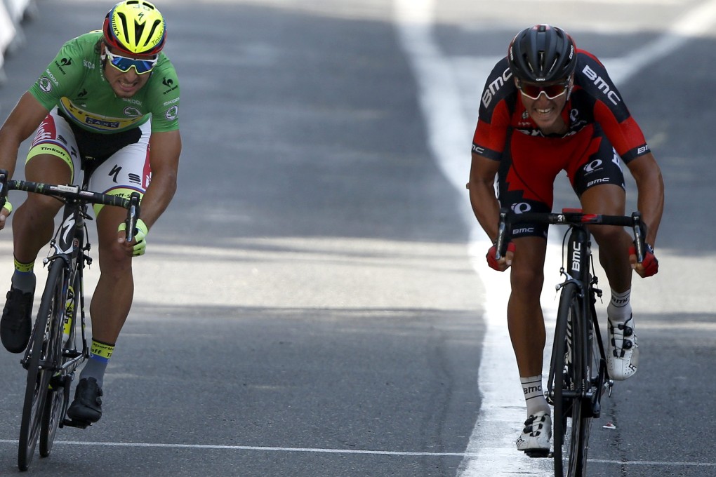 Greg Van Avermaet of Belgium sprints to win ahead of Slovak rider Peter Sagan to claim stage 13 of the Tour de France. Photo: EPA