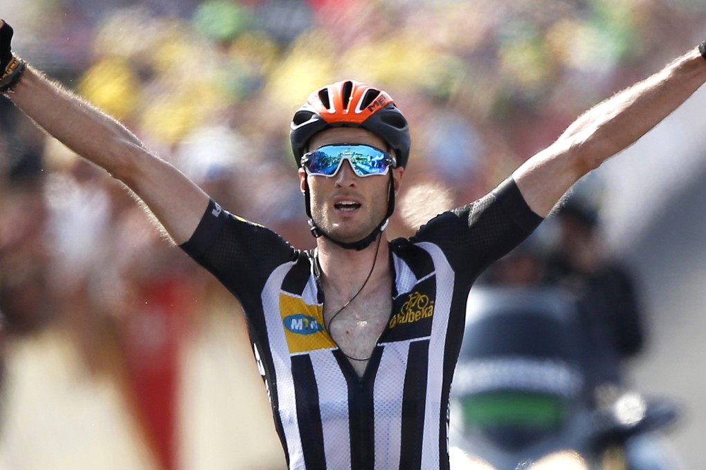 MTN-Qhubeka team rider Stephen Cummings celebrates as he wins the 14th stage of the Tour de France in Mende. Photo: EPA