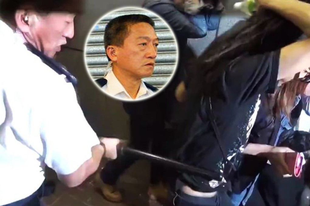 Franklin Chu King-wai, who was divisional commander for Sha Tin at the time, uses a baton to strike a pedestrian in Mong Kok. Photo: SCMP Pictures
