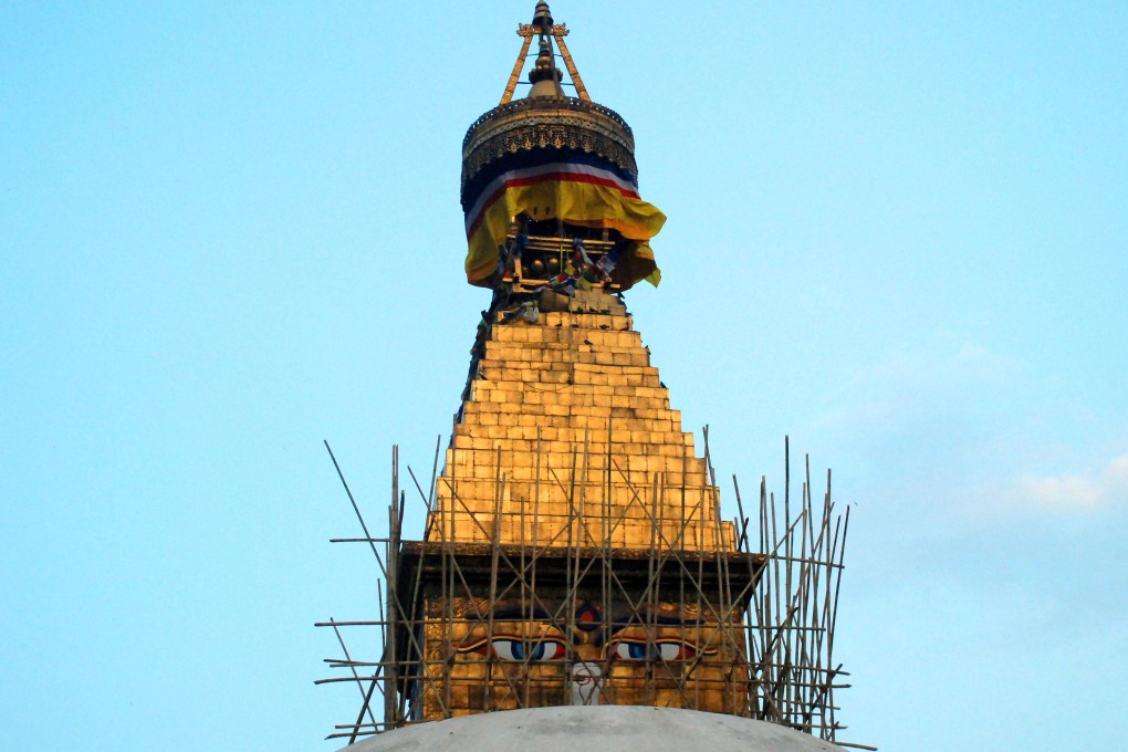 Scaffolding surrounding the damaged Boudha Stupa, Kathmandu, Nepal, after the second Nepal earthquake on May 12 damaged the structure. Photo: Ingrid Piper