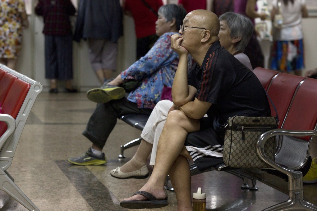 Worried Chinese investors keep a watchful eye on the sharp movements of stock markets at a brokerage house in Beijing. Photo: AP