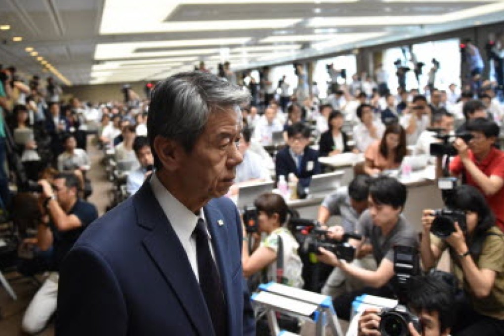 Toshiba president Hisao Tanaka arrives for a press conference at the company's headquarters in Tokyo on Tuesday. Photo: AFP