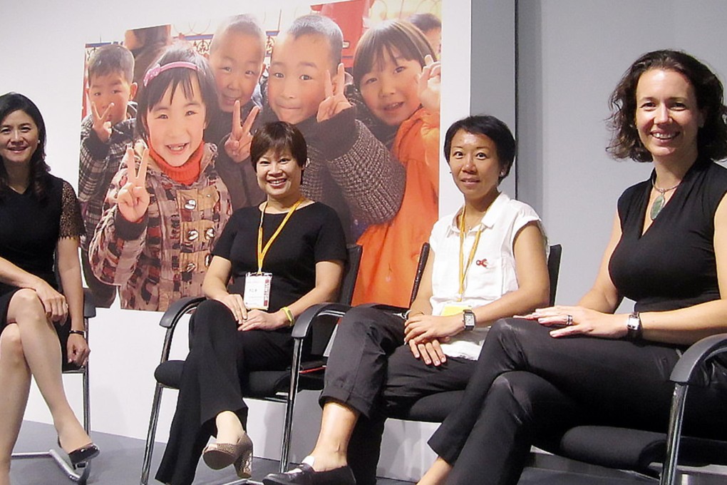 Amy Lo Choi-wan, Linda Wong Sau-yung, Mandy Cheung Hiu-wah, of Aids Concern, and Alice Page discuss projects. Photo: SCMP Pictures