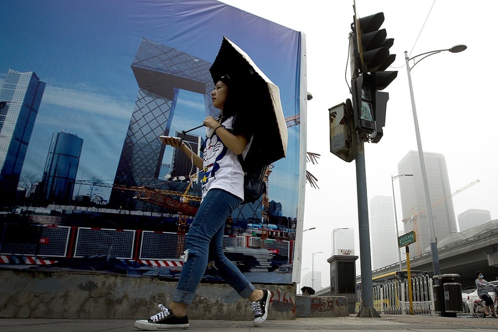Beijing's skyline is shrouded by a haze of pollution. Photo: AP