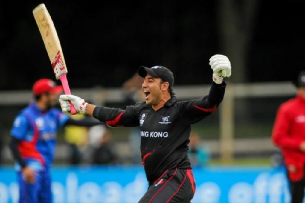 Hong Kong's Babar Hayat raises his bat in delight after hitting the winning runs against Afghanistan. Photos: ICC