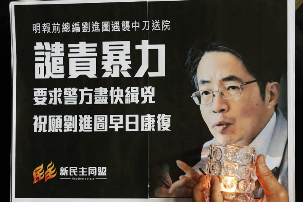 A placard with Chinese characters reading 'Condemn Violence' and a picture of Kevin Lau displayed during a demonstration outside the hospital where he is being treated. Photo: AP