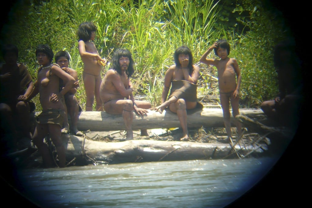 Members of the Mashco Piro tribe observe a group of travellers from across the Alto Madre de Dios river in the Manu National Park in the Amazon basin of southeastern Peru, as photographed through a bird scope in this 2011 picture. Photo: Reuters
