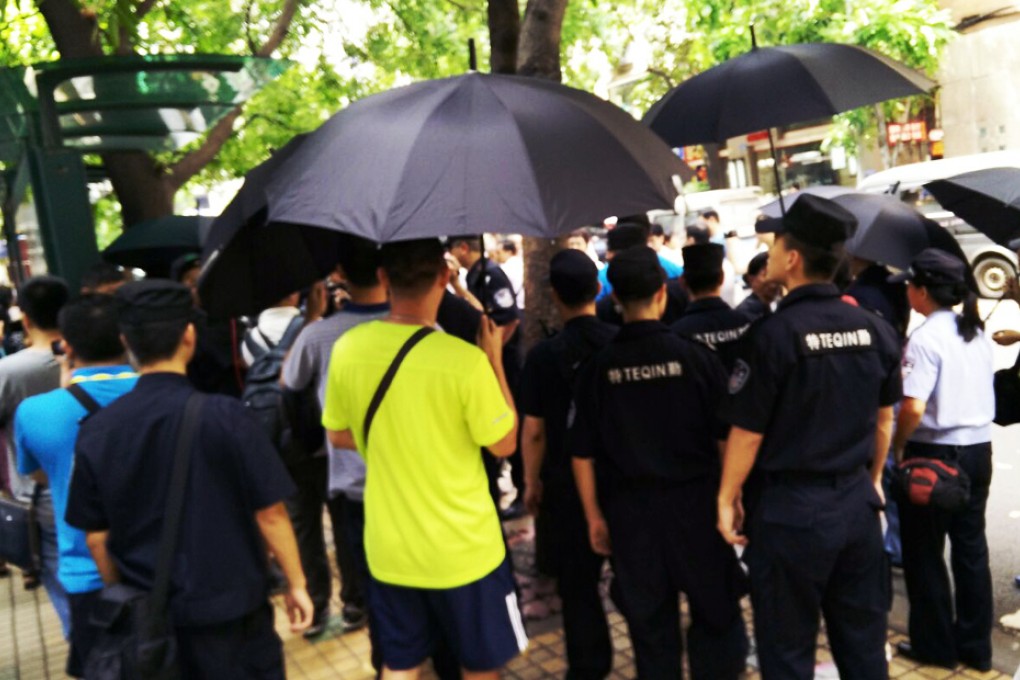 A large number of security personnel were on duty outside the Guangzhou court as the trial resumed on Thursday morning. Photo: Mimi Lau