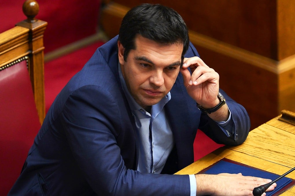 While the new law will come as a relief to Prime Minister Alexis Tsipras - who is negotiating a new bailout worth up to 86 billion euros ($93 billion) over three years -it saw him suffer a major rebellion amongst MPs in his leftist Syriza party for the second time in a week. Photo: AFP
