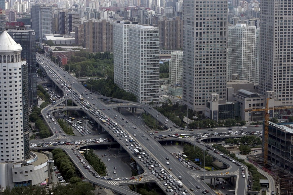 State-owned enterprises outside Beijing will be strictly prohibited from moving their headquarters to the capital under a blueprint to cap population in the city. Photo: Reuters