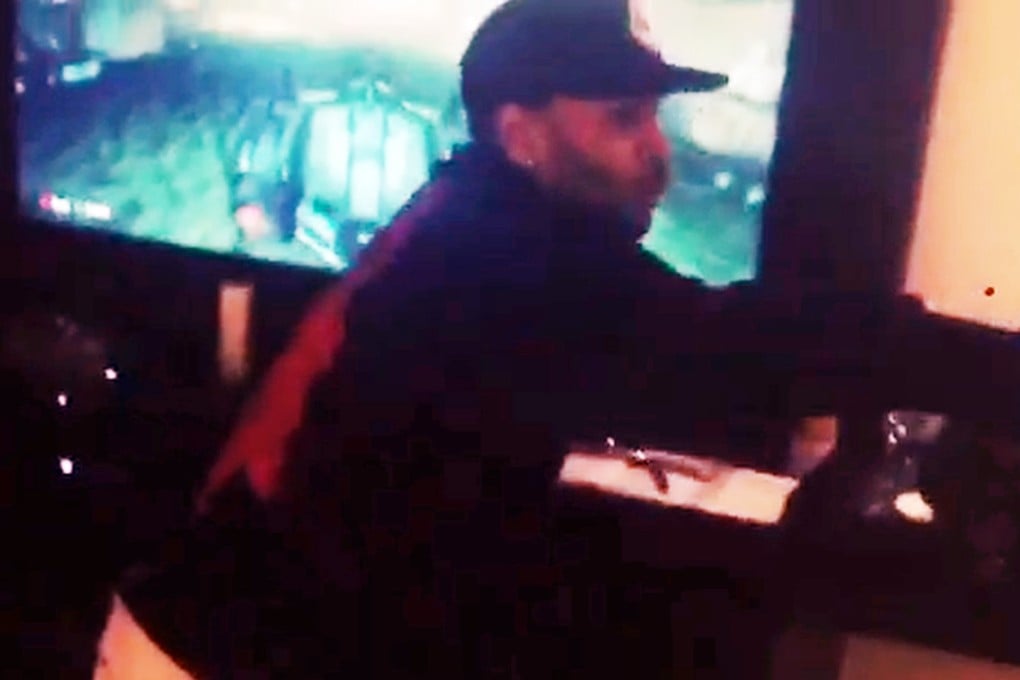 American hip-hop artist break-dances in front of a giant flat screen television in his hotel room in Manila after being prevented from leaving the country. Photo: Instagram