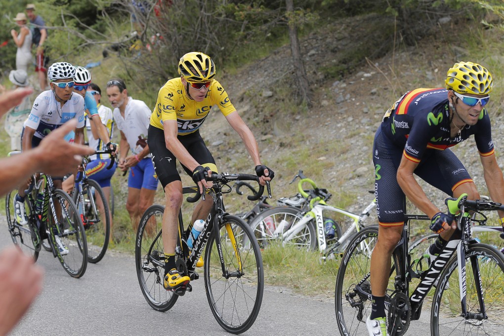 Spain's Alejandro Valverde, right, Britain's Chris Froome, wearing the overall leader's yellow jersey, and Colombia's Nairo Quintana, wearing the best young rider's white jersey, ride during the seventeenth stage. Photo: AP