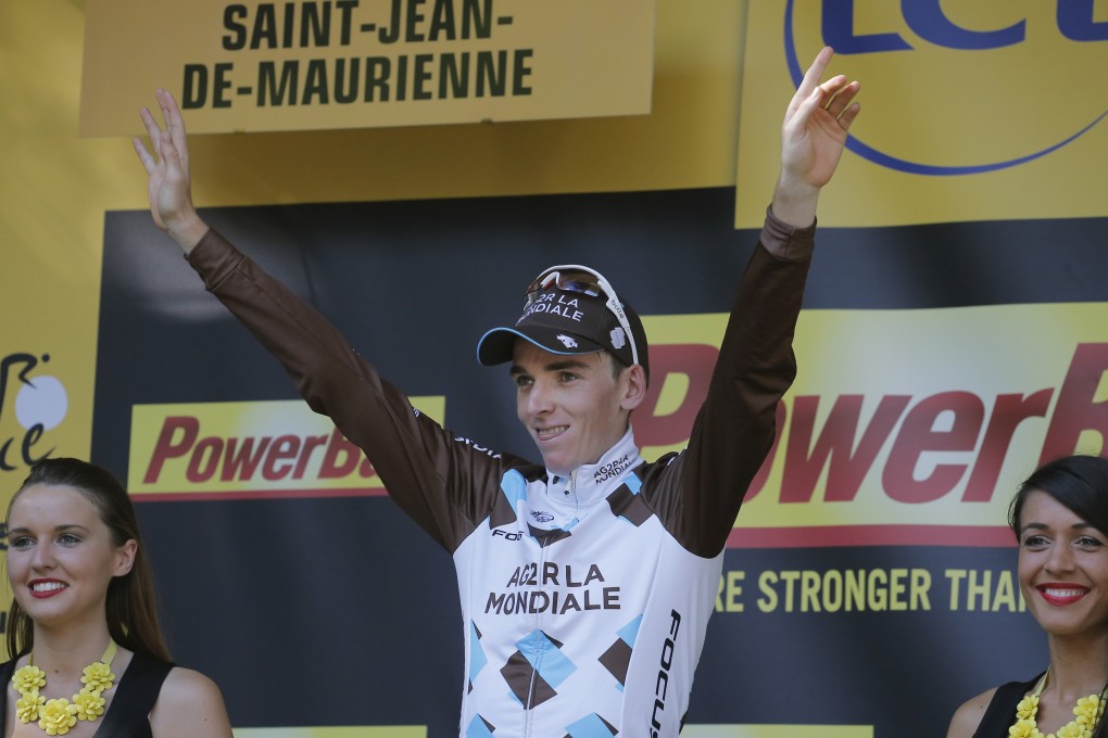 Stage winner Romain Bardet of France celebrates on the podium at the 18th stage of the Tour de France. Photo: AP