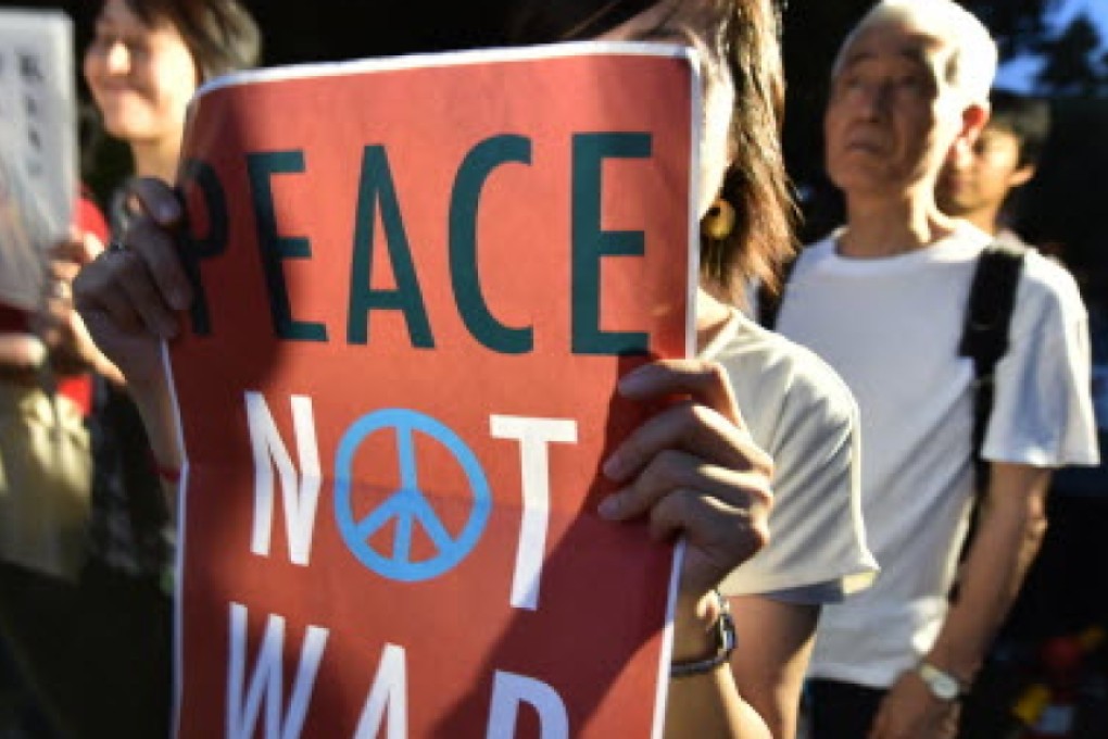 Japanese protesters made their views clear about Shinzo Abe's manipulation of the law regarding military involvement. Photo: AFP