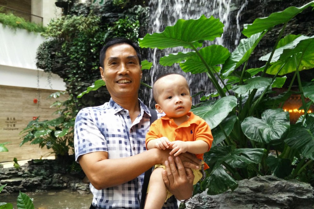 Liang Dalun poses with his grandson in the White Swan Hotel, which has undergone extensive renovation.Photo: SCMP Pictures