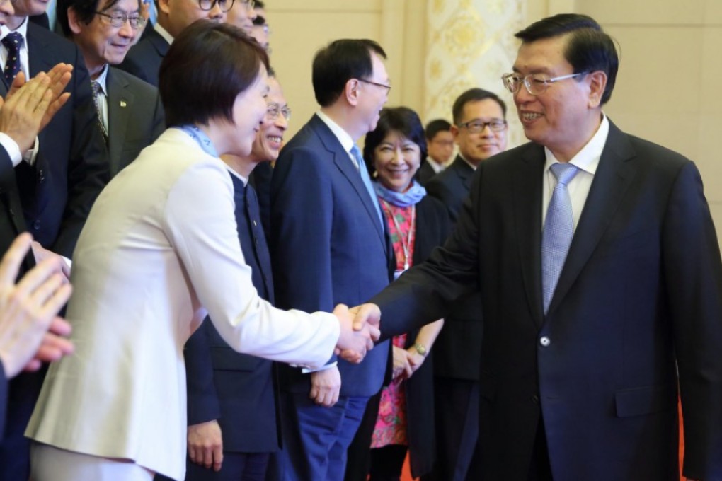 Zhang Dejiang welcomes DAB leader Starry Lee in Beijing. The NPC chairman spent two hours in talks with the party. Photo: Xinhua