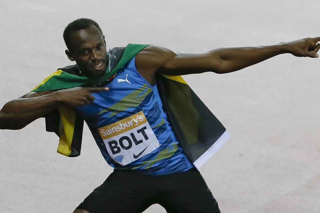 Usain Bolt makes his trademark victory gesture after his win in London. Photo: AP