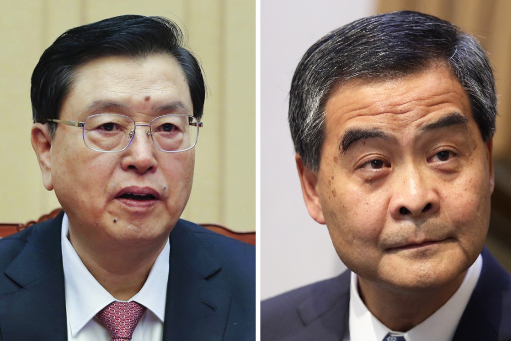 Leung Chun-ying (right) said Zhang Dejiang (left) was "very satisfied" with his performance over the past 20 months in attempting to reform the city's political system. Photos: Xinhua, David Wong