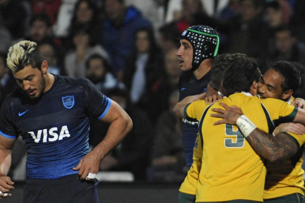 Wallaby Joe Tomane celebrates scoring a try in the win over Argentina. Photo: AFP