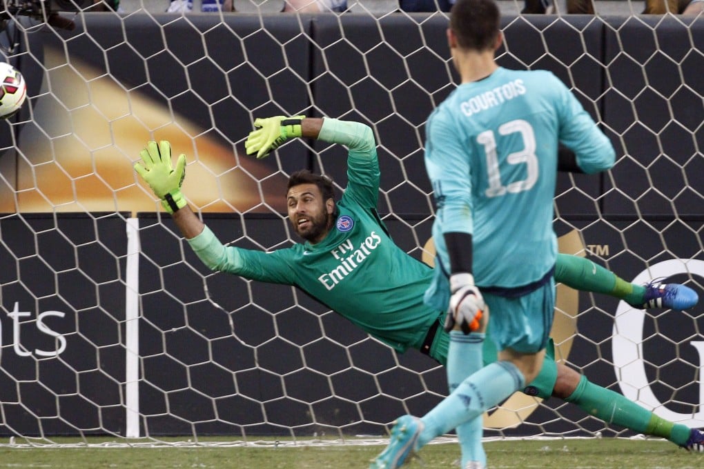 Thibaut Courtois fires home from the spot. Photo: AP