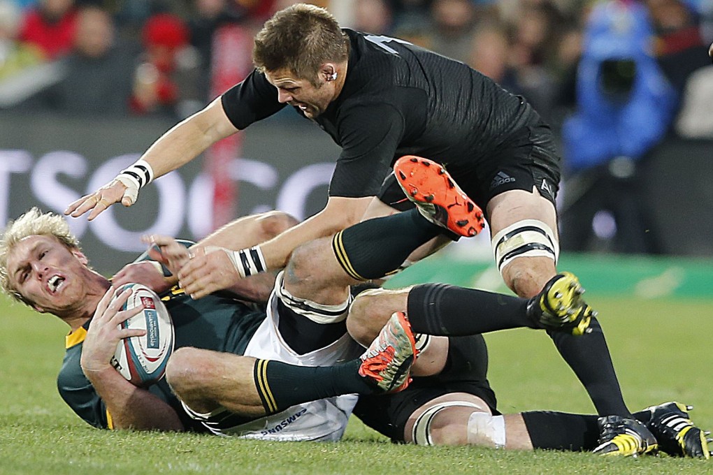 Captains Schalk Burger of the Springboks and Richie McCaw of the All Blacks tangle in their Rugby Championship clash in Johannesburg. New Zealand won 27-20. Photo: AFP