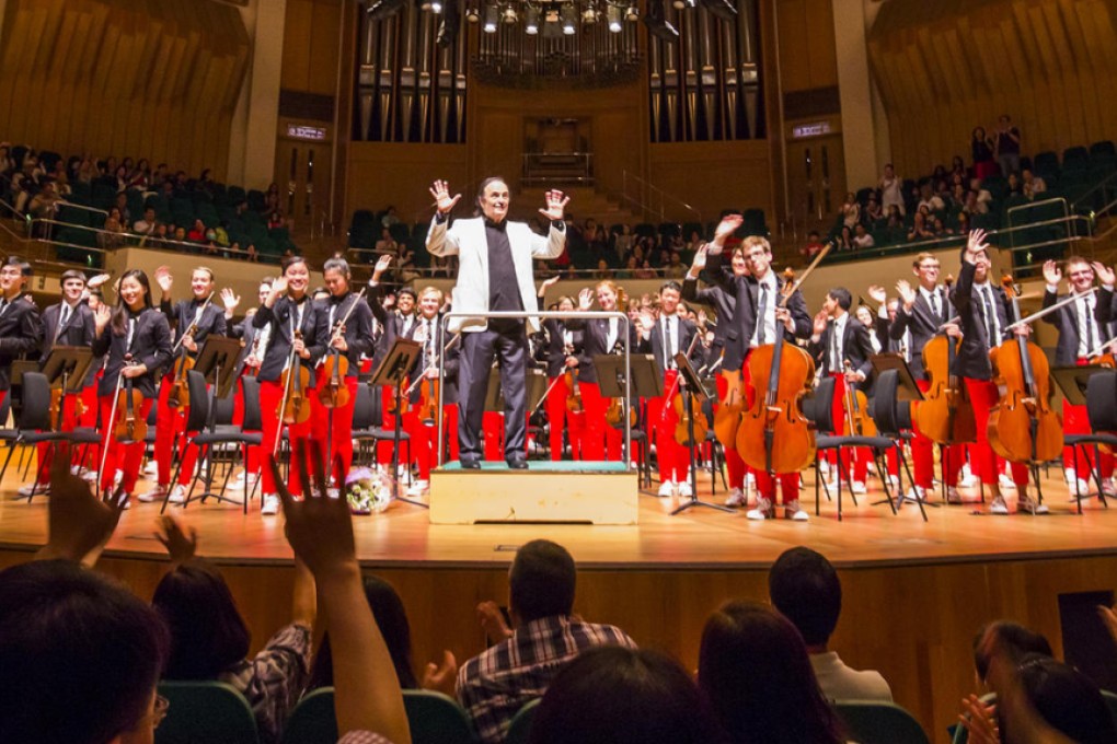 The National Youth Orchestra of the United States of America and conductor Charles Dutoit bask in the applause of the Cultural Centre audience. Photo: Chris Lee