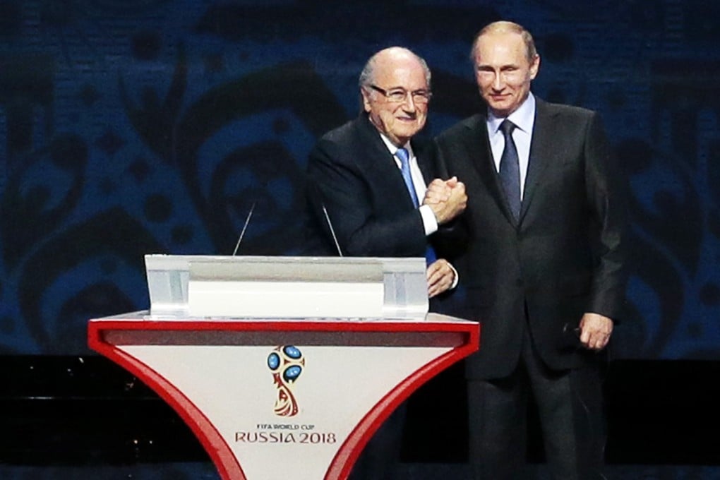 FIFA President Sepp Blatter, left, and Russian President Vladimir Putin open the preliminary draw for the 2018 soccer World Cup in Konstantin Palace in St. Petersburg, Russia. Photo: AP