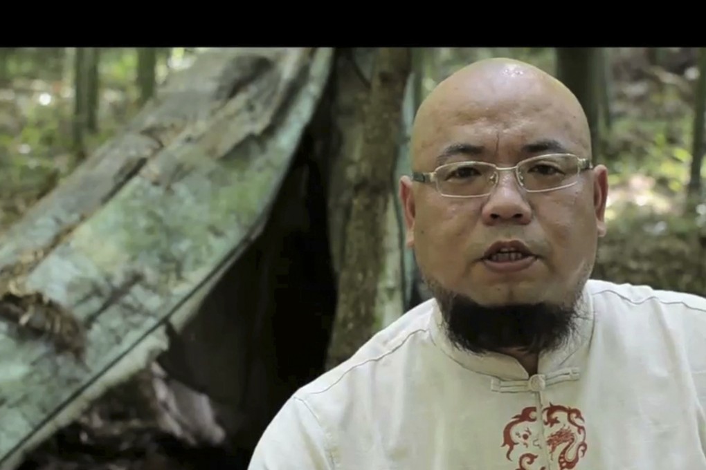 Activist Wu Gan is seen with the subtitle "I am Wu Gan. My internet name is Super Vulgar Butcher” in Sanming in Fujian province. Photo: AP