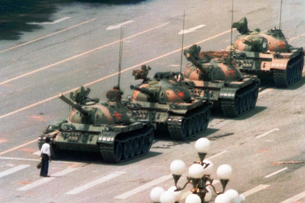 A Chinese man stands in front of a line of tanks heading east on Beijing's Cangan Blvd., in Tiananmen Square in this June 5, 1989, file photo. Photo: AP