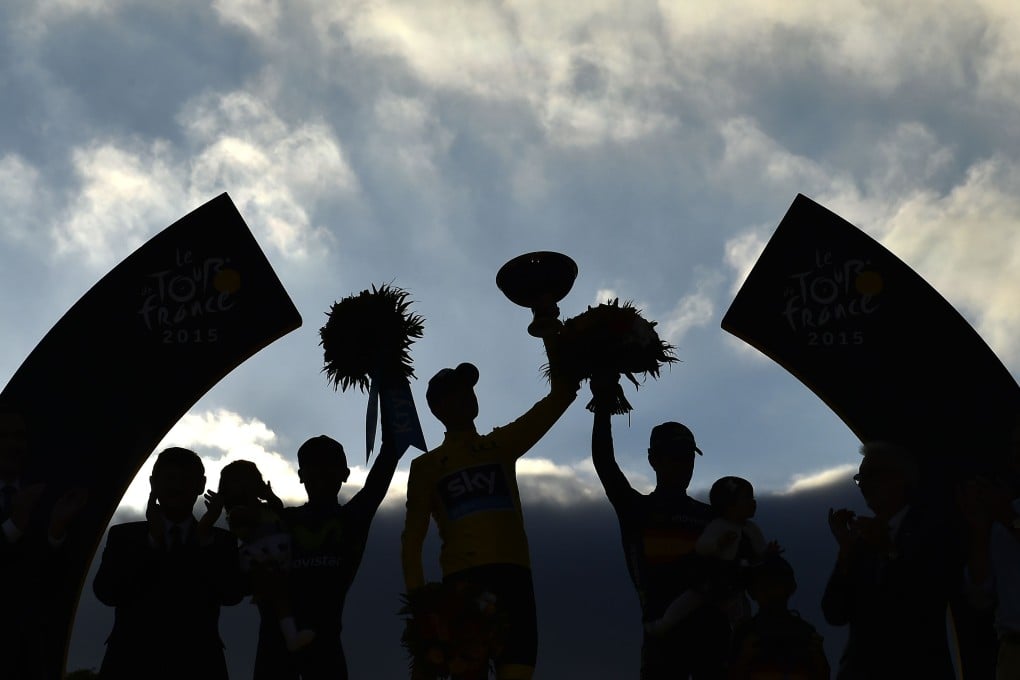 Winner Christopher Froome (C), second-placed  Nairo Quintana (2nd  L) and third-placed  Alejandro Valverde (3rd R) celebrate on the podium, on the Champs-Elysees. Photo: AFP