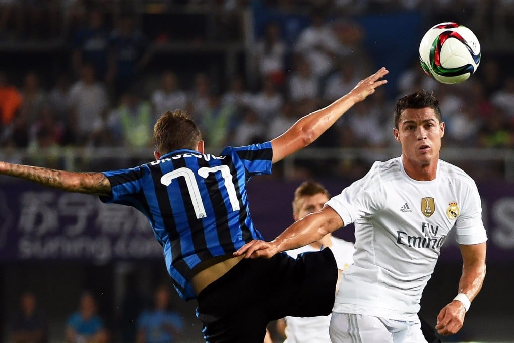 Real Madrid’s Cristiano Ronaldo battles for possession with Inter Milan’s Marcelo Brozovic in their International Champions Cup match in Guangzhou. Photo: EPA
