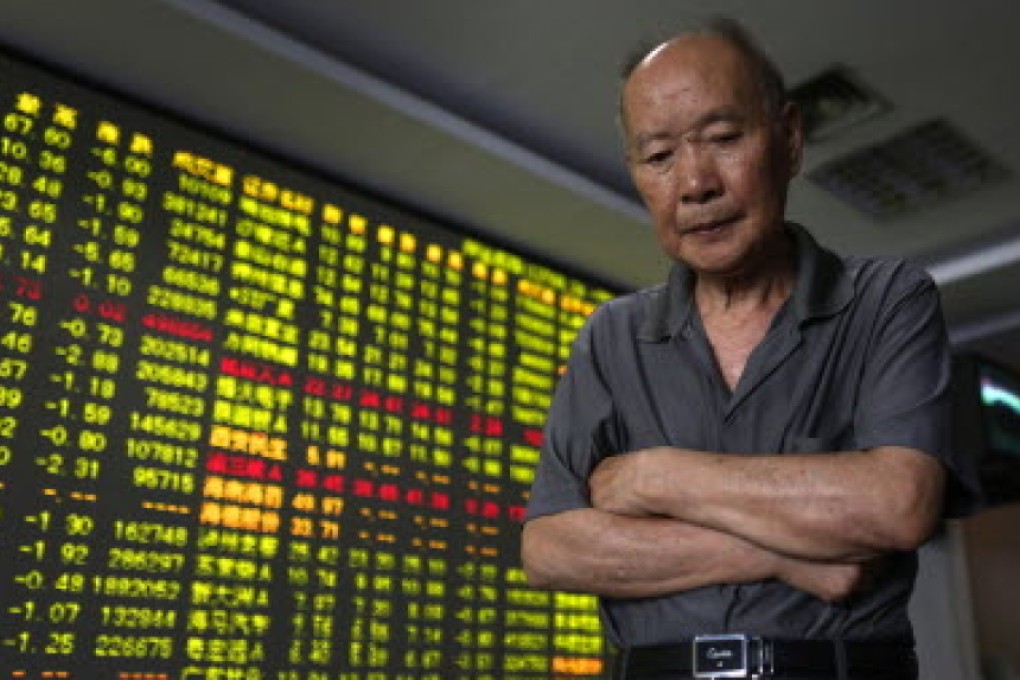 A Zhejiang province investor's expression reflects the stock market's woes. Photo: AP