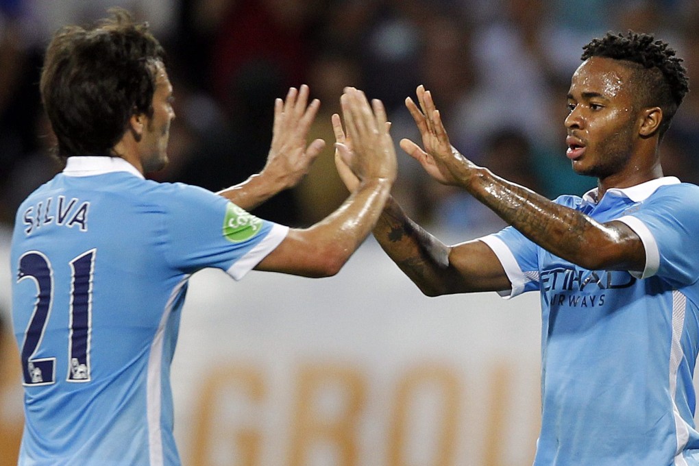 Raheem Sterling celebrates with David Silva. Photo: EPA