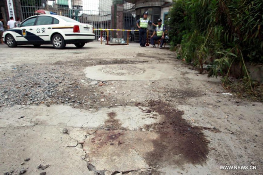 Bloodstains are left on the ground at the Chinese factory where Fan Jieming attacked his colleagues. Photo: Xinhua