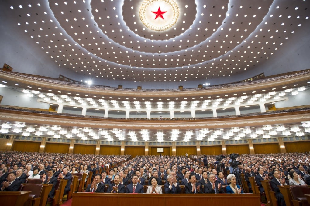 Delegates meeting at the National People's Congress in Beijing. The new regulations clarify the procedure for demoting officials. Photo: Xinhua