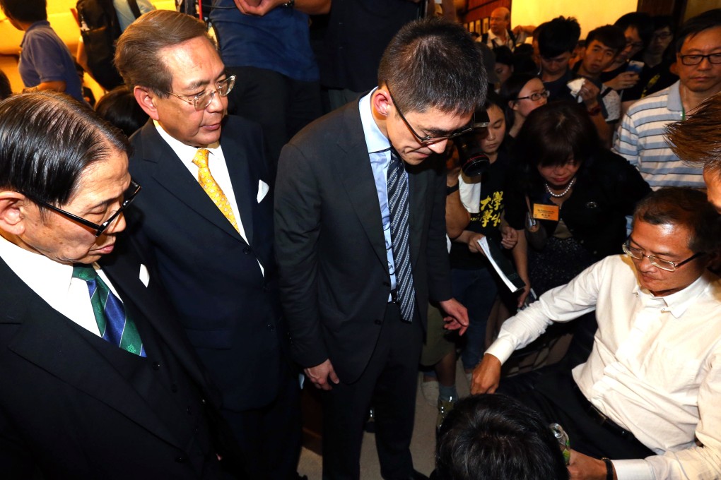 HKU council member Dr Lo Chung-mau (right) collapsed in the midst of the chaos. It was unclear whether he fainted or was pushed. Photos: SCMP Pictures