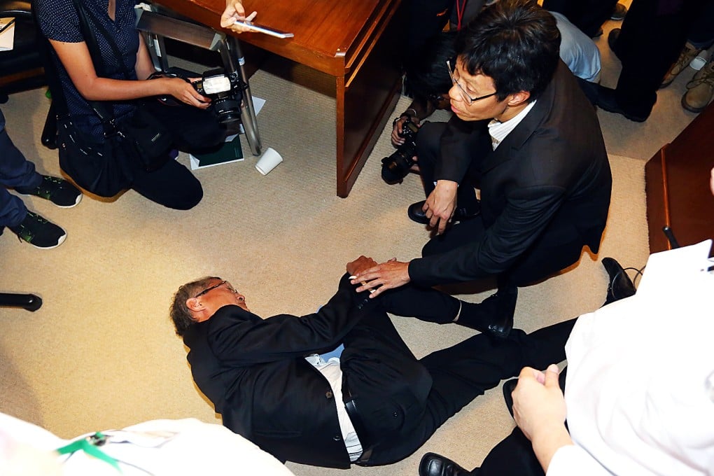 Professor Lo Chung-mau collapsed to the floor on Tuesday night. Photo: SCMP Pictures