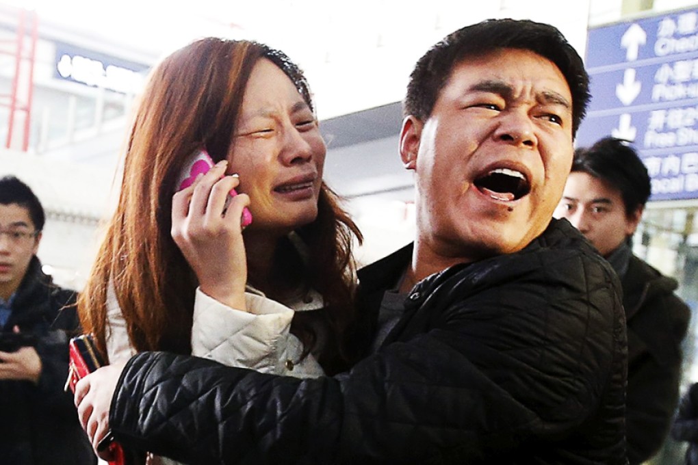 Distraught relatives await news at Beijing airport after MH370 went missing last March. Photo: Reuters