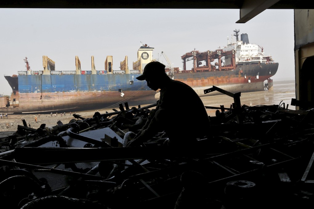 A worker toils at a a shipyard in Gujarat, India, as the government plans to implement a raft of labour reforms in the country. Photo: Reuters