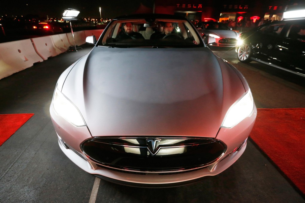 It costs about US$2,000 more to sell a Tesla Model S through one of the company stores than directly to the customer. Photo: Reuters