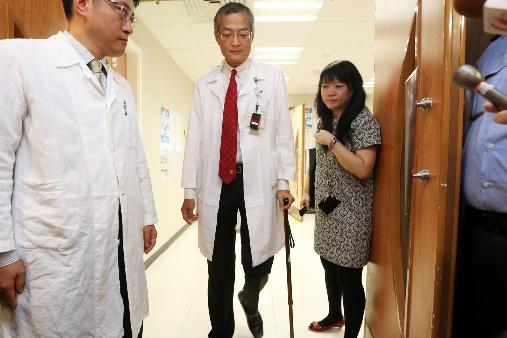 Professor Lo Chung-mau, who fell during the chaotic council meeting, prepares to meet the press at Queen Mary Hospital. Photo: Sam Tsang