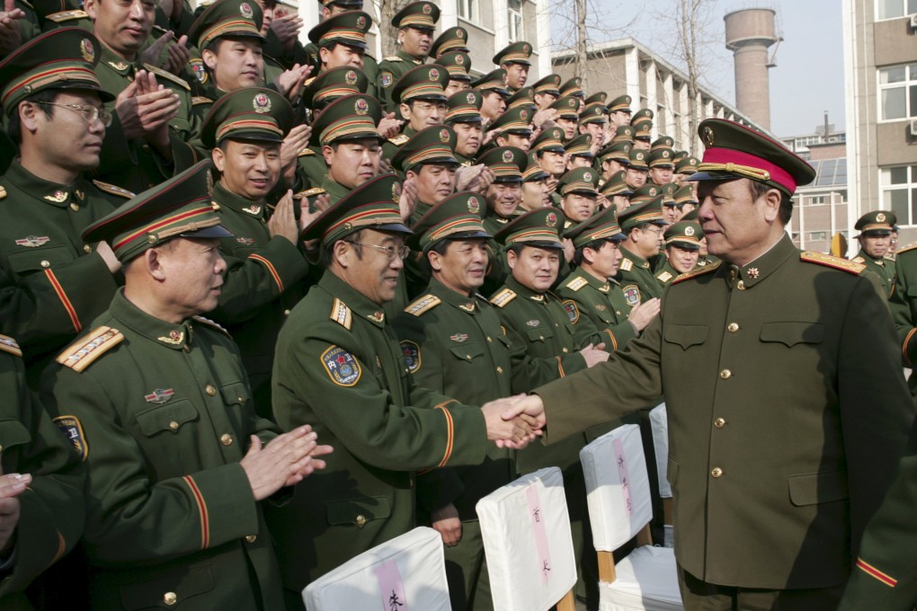 Guo, right, meeting troops during his term as one of the top leaders in the PLA. Photo: Reuters