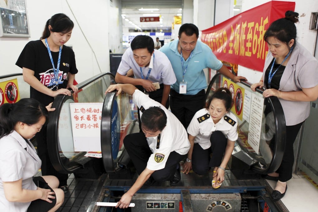 The authorities inspect an escalator in Yongchuan district, southwest China's Chongqing municipality, on Thursday. Photo: AP