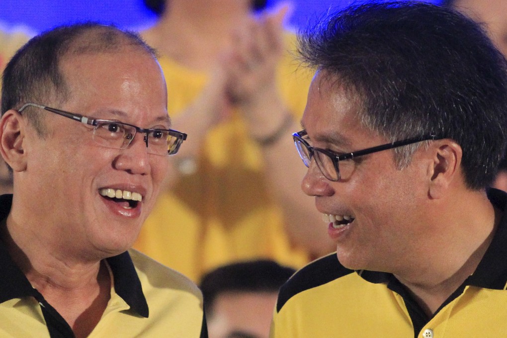 President Benigno Aquino (left) shares a light moment with Interior Secretary Manuel "Mar" Roxas. Photo: Reuters