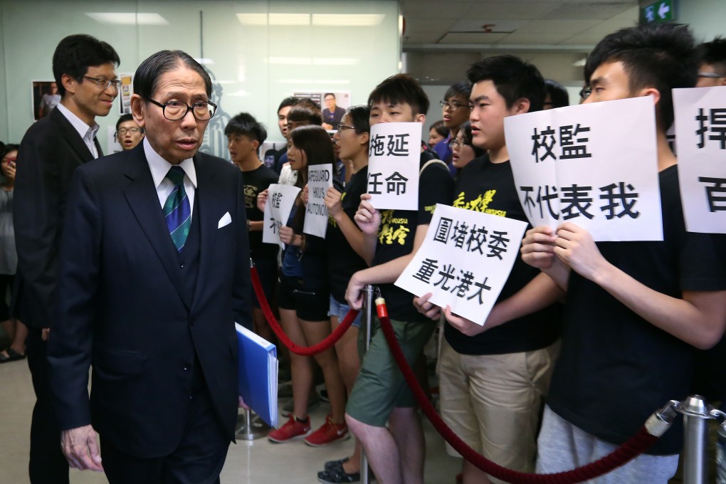 HKU council chairman Dr Leong Che-hung (left) receives a petition from students and alumni concern group members. Photo: Dickson Lee