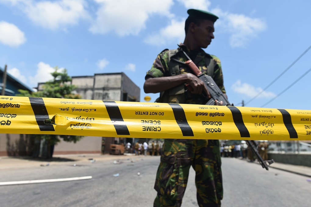 A Sri Lankan soldier stands guard at the site of the shooting in the capital Colombo. Photo: AFP