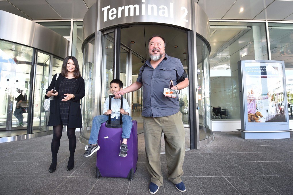 Chinese artist Ai Weiwei at Munich Airport with his son Ai Lao and partner Wang Fen on Thursday. Photo: EPA