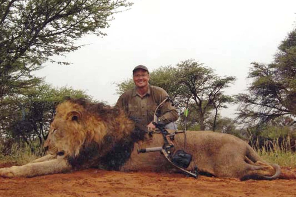 Walter Palmer poses alongside a previous kill. Photo: SCMP Pictures