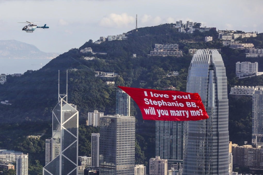 The helicopter hauled the massive banner - the size of a basketball court - past the Ritz Carlton at the right time. Photo: Edward Wong